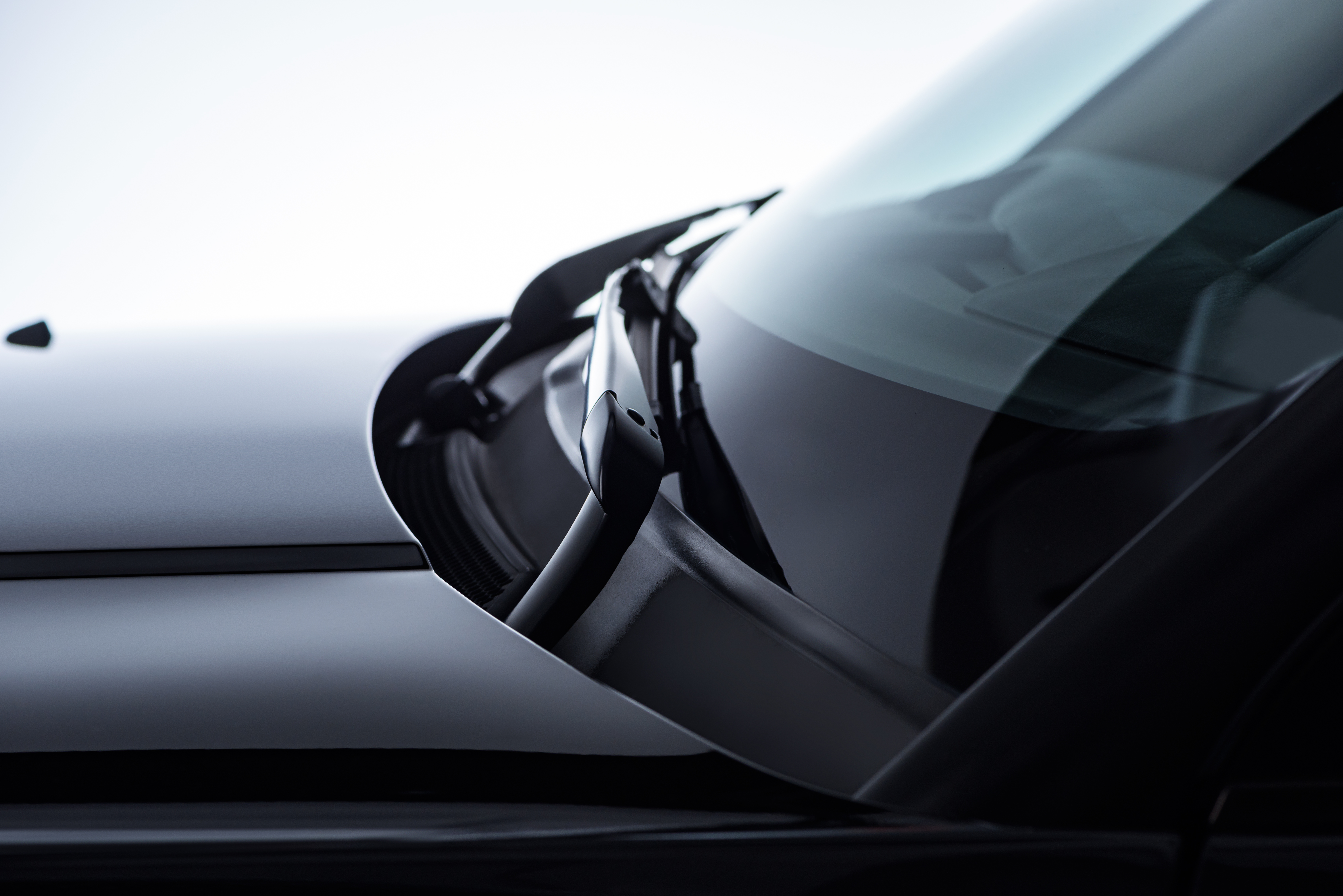 worker-cleaning-modern-vehicle-alloy-wheels